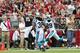 GLENDALE, AZ - OCTOBER 06: Wide receiver Michael Floyd #15 of the Arizona Cardinals attempts to make a catch past strong safety Robert Lester #38 and cornerback Drayton Florence #29 of the Carolina Panthers during the second quarter of the NFL game at th
