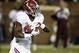 Nov 16, 2013; Starkville, MS, USA; Alabama Crimson Tide running back T.J. Yeldon (4) carries against the Mississippi State Bulldogs during the first quarter at Davis Wade Stadium. Mandatory Credit: John David Mercer-USA TODAY Sports