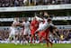 LONDON, ENGLAND - MAY 04: Artur Boruc of Southampton punches the ball clear of Jermain Defoe of Tottenham Hotspur during the Barclays Premier League match between Tottenham Hotspur and Southampton at White Hart Lane on May 4, 2013 in London, England. (P