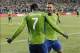 Oct 27, 2013; Seattle, WA, USA; Seattle Sounders forward Clint Dempsey (2) and Seattle Sounders forward Eddie Johnson (7) celebrate after Dempsey scored a goal against the Los Angeles Galaxy during the 1st half at CenturyLink Field. Mandatory Credit: Stev