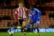 SUNDERLAND, ENGLAND - DECEMBER 17: Craig Gardner of Sunderland puts Samuel Eto'o of Chelsea under pressure during the Capital One Cup Quarter-Final match between Sunderland and Chelsea at Stadium of Light on December 17, 2013 in Sunderland, England. (P