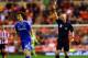 SUNDERLAND, ENGLAND - DECEMBER 17: Referee Anthony Taylor shows David Luiz of Chelsea a yellow card during the Capital One Cup Quarter-Final match between Sunderland and Chelsea at Stadium of Light on December 17, 2013 in Sunderland, England. (Photo by