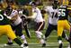 GREEN BAY, WI - NOVEMBER 04: Josh McCown #12 of the Chicago Bears looks for a receiver against the Green Bay Packers at Lambeau Field on November 4, 2013 in Green Bay, Wisconsin. The Bears defeated the Packers 27-20. (Photo by Jonathan Daniel/Getty Imag