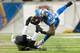 DETROIT, MI - DECEMBER 16: Tight end Brandon Pettigrew #87 of the Detroit Lions is tackled by free safety Matt Elam #26 of the Baltimore Ravens during the second half at Ford Field on December 16, 2013 in Detroit, Michigan. The Ravens defeated the Lions 1