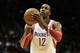 HOUSTON, TX - DECEMBER 08: Dwight Howard #12 of the Houston Rockets take a free throw during the game against the Orlando Magic at Toyota Center on December 8, 2013 in Houston, Texas. NOTE TO USER: User expressly acknowledges and agrees that, by download
