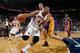 ATLANTA, GA - DECEMBER 16: Al Horford #15 of the Atlanta Hawks draws a foul from Pau Gasol #16 of the Los Angeles Lakers at Philips Arena on December 16, 2013 in Atlanta, Georgia. NOTE TO USER: User expressly acknowledges and agrees that, by downloading