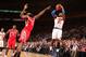 NEW YORK, NY - NOVEMBER 14: Iman Shumpert #21 of the New York Knicks shoots against James Harden #13 of the Houston Rockets during a game at Madison Square Garden in New York City on November 14, 2013. NOTE TO USER: User expressly acknowledges and agrees