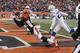 CINCINNATI, OH - DECEMBER 08: Marvin Jones #82 of the Cincinnati Bengals hauls in the touchdown pass in front of Vontae Davis #23 of the Indianapolis Colts during their game at Paul Brown Stadium on December 8, 2013 in Cincinnati, Ohio. The Bengals defe