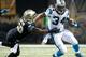 NEW ORLEANS, LA - DECEMBER 08: Running back DeAngelo Williams #34 of the Carolina Panthers runs to escape the defense of Curtis Lofton #50 of the New Orleans Saints at Mercedes-Benz Superdome on December 8, 2013 in New Orleans, Louisiana. (Photo by Chri