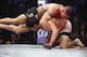 Oct 19, 2013; Houston, TX, USA; Gilbert Melendez (red gloves) fights against Diego Sanchez (blue gloves) in their lightweight bout during UFC 166 at Toyota Center. Mandatory Credit: Andrew Richardson-USA TODAY Sports
