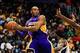 Dec 16, 2013; Atlanta, GA, USA; Los Angeles Lakers shooting guard Kobe Bryant (24) tries to keep the ball in bounds in the first quarter against the Atlanta Hawks at Philips Arena. Mandatory Credit: Daniel Shirey-USA TODAY Sports