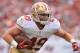TAMPA, FL - DECEMBER 15: Fullback Bruce Miller #49 of the San Francisco 49ers runs upfield against the Tampa Bay Buccaneers December 15, 2013 at Raymond James Stadium in Tampa, Florida. (Photo by Al Messerschmidt/Getty Images)
