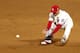 ST LOUIS, MO - OCTOBER 26: Kolten Wong #16 of the St. Louis Cardinals fields the ball against the Boston Red Sox during Game Three of the 2013 World Series at Busch Stadium on October 26, 2013 in St Louis, Missouri. (Photo by Elsa/Getty Images)