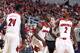 LOUISVILLE, KY - DECEMBER 7: Russ Smith #2, Chris Jones #3 and Montrezl Harrell #24 of the Louisville Cardinals celebrate after a basket against the Louisiana-Lafayette Ragin' Cajuns during the game at KFC Yum! Center on December 7, 2013 in Louisville, Ke
