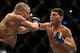 Mar 16, 2013; Montreal, Quebec, CAN; Nick Diaz (blue) lands a punch on Georges St.Pierre (red) during their Welterweight title bout at UFC 158 at the Bell Centre. Mandatory Credit: Eric Bolte-USA TODAY Sports