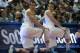 ANAHEIM, CA - JANUARY 05: Twin brothers David Wear #12 (L) and Travis Wear #24 of the UCLA Bruins kneel by the scorer's table as they wait to enter the game against the Arizona Wildcats at the Honda Center on January 5, 2012 in Anaheim, California. UCLA