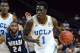 LAS VEGAS, NV - NOVEMBER 28: Wanaah Bail #1 of the UCLA Bruins drives in front of Deonte Burton #24 of the Nevada Wolf Pack during the Continental Tire Las Vegas Invitational at the Orleans Arena on November 28, 2013 in Las Vegas, Nevada. UCLA won 105-84