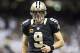 NEW ORLEANS, LA - DECEMBER 8: Drew Brees #9 of the New Orleans Saints jogs onto the field during a game against the Carolina Panthers at Mercedes-Benz Superdome on December 8, 2013 in New Orleans, Louisiana. The Saints defeated the Panthers 31-13. (Pho