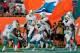 The Dolphins celebrate after scoring the go-ahead touchdown late in the fourth quarter on Sunday.