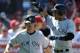 ANAHEIM, CA - SEPTEMBER 11: Derek Jeter #2 and Brett Gardner #11 of the New York Yankees celebrate their two runs for a 6-5 lead off of an error by Peter Bourjos #25 of the Los Angeles Angels of Anaheim during the seventh inning at Angel Stadium of Anahe