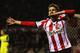 SUNDERLAND, ENGLAND - DECEMBER 17: Fabio Borini of Sunderland celebrates as he scores their first goal during the Capital One Cup Quarter-Final match between Sunderland and Chelsea at Stadium of Light on December 17, 2013 in Sunderland, England. (Photo