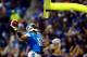 Nov 28, 2013; Detroit, MI, USA; Detroit Lions wide receiver Calvin Johnson (81) dunks the football over the goal post after scoring a touchdown during the third quarter of a NFL football game against the Green Bay Packers on Thanksgiving at Ford Field. Ma