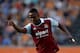 HULL, ENGLAND - SEPTEMBER 28: Modibo Maiga of West Ham runs with the ball during the Barclays Premier League match between Hull City and West Ham United at KC Stadium on September 28, 2013 in Hull, England. (Photo by Gareth Copley/Getty Images)