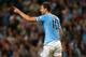 MANCHESTER, ENGLAND - SEPTEMBER 24: Edin Dzeko of Manchester City celebrates after scoring the opening goal during the Capital One Cup third round match between Manchester City and Wigan Athletic at Etihad Stadium on September 24, 2013 in Manchester, Eng