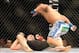 Nov 17, 2012; Montreal, QC, Canada; Johny Hendricks (white) goes in for a punch after knocking Martin Kampmann (black) to the mat during first round action of their Welterweight bout at UFC 154 at the Bell Centre. Mandatory Credit: Eric Bolte-USA TODAY