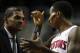 Oct 8, 2013; Auburn Hills, MI, USA; Detroit Pistons head coach Maurice Cheeks listens to point guard Brandon Jennings (7)during the second quarter against Haifa at The Palace of Auburn Hills. Mandatory Credit: Raj Mehta-USA TODAY Sports