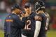 CHICAGO, IL - OCTOBER 10: Head coach Marc Trestman of the Chicago Bears talks with Josh McCown #12 and Jay Cutler #6 during a game against the New York Giants at Soldier Field on October 10, 2013 in Chicago, Illinois. The Bears defeated the Giants 27-21.