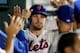 NEW YORK, NY - JULY 23: Daniel Murphy #28 of the New York Mets is congratulated after he scored a run in the sixth inning against the Atlanta Braves on July 23, 2013 at Citi Field in the Flushing neighborhood of the Queens borough of New York City. (Pho