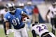 DETROIT, MI - DECEMBER 16: Calvin Johnson #81 of the Detroit Lions runs for a short gain during the third quarter of the game against the Baltimore Ravens at Ford Field on December 16, 2013 in Detroit, Michigan. The Ravens defeated the Lions 18-16. (Photo