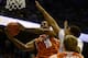 Dec 18, 2013; Chapel Hill, NC, USA; Texas Longhorns forward Jonathan Holmes (10) shoots ahead of North Carolina Tar Heels forward James Michael McAdoo (43) during the first half at the Dean E. Smith Student Activities Center. Mandatory Credit: Rob Kinnan-