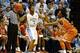 Dec 18, 2013; Chapel Hill, NC, USA; North Carolina Tar Heels guard Leslie McDonald (2) looks to pass as he is guarded by Texas Longhorns guard Isaiah Taylor (1) during the first half at the Dean E. Smith Student Activities Center. Mandatory Credit: Rob Ki