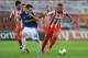 PIRAEUS, GREECE - AUGUST 25: Konstantinos Mitroglou (R) of Olympiacos FC in action against Garcia Miguel Sebastian of Atromitos FC during the greek Super League match between Olympiacos FC and Atromitos FC at Karaiskakis Stadium on August 25, 2013 in Pir