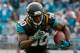 JACKSONVILLE, FL - DECEMBER 15: Jordan Todman #30 of the Jacksonville Jaguars runs for yardage during the game against the Buffalo Bills at EverBank Field on December 15, 2013 in Jacksonville, Florida. (Photo by Sam Greenwood/Getty Images)