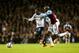LONDON, ENGLAND - DECEMBER 18: Danny Rose of Tottenham Hotspur battles with Alou Diarra of West Ham United during the Capital One Cup Quarter-Final match between Tottenham Hotspur and West Ham United at White Hart Lane on December 18, 2013 in London, Eng
