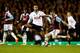LONDON, ENGLAND - DECEMBER 18: Matthew Taylor of West Ham United is watched by Mousa Dembele of Tottenham Hotspur during the Capital One Cup Quarter-Final match between Tottenham Hotspur and West Ham United at White Hart Lane on December 18, 2013 in Lond