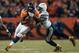 DENVER, CO - DECEMBER 12: Running back Montee Ball #28 of the Denver Broncos rushes as inside linebacker Donald Butler #56 of the San Diego Chargers attempts a tackle during a game at Sports Authority Field Field at Mile High on December 12, 2013 in Denv