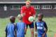 MOUNT EDGECOMBE, SOUTH AFRICA - NOVEMBER 14: Dietmar Hamann instructs young players during the Liverpool FC Legends Tour CSI and Coaching Clinic at Siphosethu Primary School on November 14, 2013 in Mount Edgecombe, South Africa. (Photo by Anesh Debiky/I
