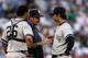 Igawa with catcher Jose Molina and pitching coach Ron Guidry.