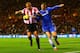 SUNDERLAND, ENGLAND - DECEMBER 04: Wes Brown of Sunderland challenges for the ball with Fernando Torres of Chelsea during the Barclays Premier League match between Sunderland and Chelsea at Stadium of Light on December 4, 2013 in Sunderland, England. (Ph