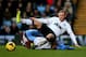BIRMINGHAM, ENGLAND - DECEMBER 15: Wayne Rooney of Manchester United is tackled by Matthew Lowton of Aston Villa during the Barclays Premier League match between Aston Villa and Manchester United at Villa Park on December 15, 2013 in Birmingham, England.