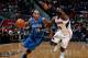 ATLANTA, GA - NOVEMBER 26: Jameer Nelson #14 of the Orlando Magic drives against Shelvin Mack #8 of the Atlanta Hawks at Philips Arena on November 26, 2013 in Atlanta, Georgia. NOTE TO USER: User expressly acknowledges and agrees that, by downloading a