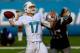 MIAMI GARDENS, FL - DECEMBER 15: Ryan Tannehill #17 of the Miami Dolphins attempts to pass the ball under pressure from Chandler Jones #95 of the New England Patriots at Sun Life Stadium on December 15, 2013 in Miami Gardens, Florida. (Photo by Chris T