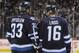 WINNIPEG, CANADA - FEBRUARY 23: Dustin Byfuglien #33 and Andrew Ladd #16 of the Winnipeg Jets discuss strategy during a first period stoppage in action against the Tampa Bay Lightning at the MTS Centre on February 23, 2012 in Winnipeg, Manitoba, Canada. T