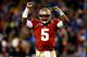 CHARLOTTE, NC - DECEMBER 07: Quarterback Jameis Winston #5 of the Florida State Seminoles celebrates a second quarter touchdown against the Duke Blue Devils during the ACC Championship game at Bank of America Stadium on December 7, 2013 in Charlotte, Nort