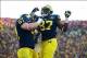 Nov 30, 2013; Ann Arbor, MI, USA; Michigan Wolverines tight end Devin Funchess (87) celebrates with offensive linesman Kyle Kalis (67) after catching a pass in the touchdown during the fourth quarter against the Ohio State Buckeyes at Michigan Stadium. Ma
