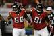 Oct 7, 2013; Atlanta, GA, USA; Atlanta Falcons defensive end Osi Umenyiora (50) reacts with defensive tackle Corey Peters (91) after a sack against the New York Jets during the second half at the Georgia Dome. The Jets defeated the Falcons 30-28. Mandator